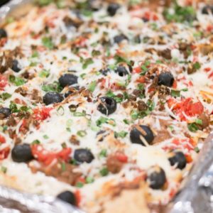 super nachos shown on a baking tray