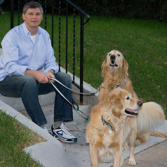 photo of Paul with his Golden Retrievers, Romeo and Rocco