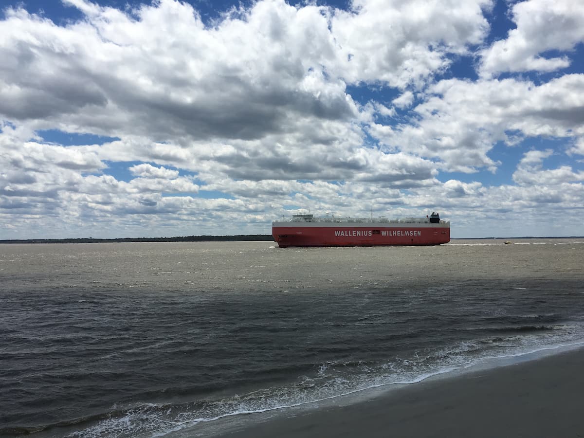 A cargo ship leaving port, East Beach, St Simons Island, GA